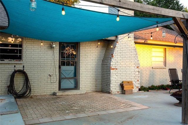 property entrance with a patio