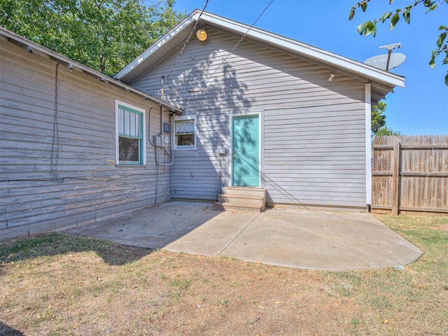 back of house with a patio