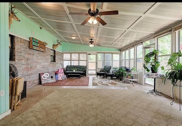 unfurnished sunroom with plenty of natural light and ceiling fan