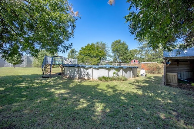 view of yard featuring a covered pool