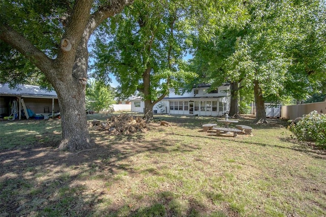 view of yard with a sunroom