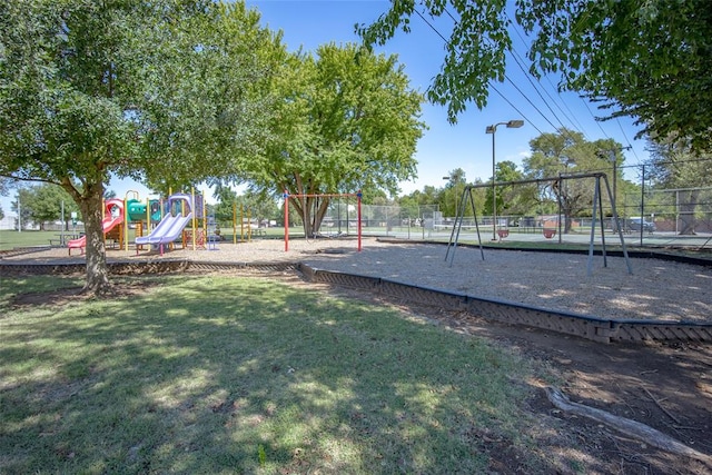 view of playground featuring a lawn