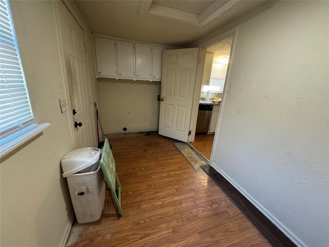 laundry area with light hardwood / wood-style floors