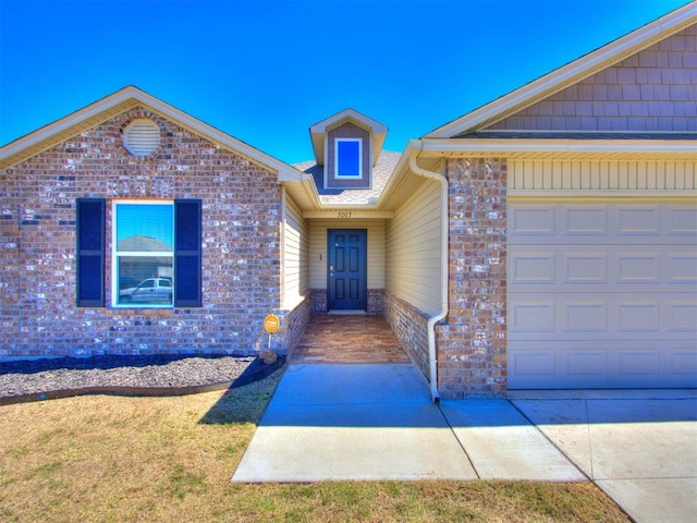 view of front of property with a garage