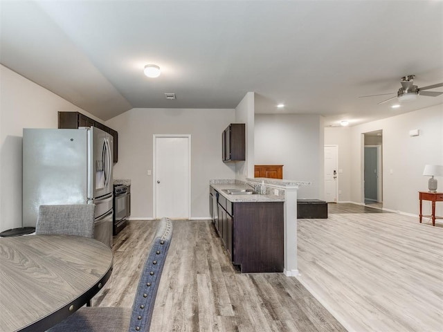 kitchen with black range oven, light hardwood / wood-style flooring, stainless steel fridge with ice dispenser, ceiling fan, and dark brown cabinetry