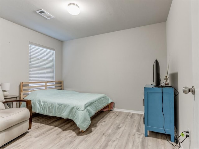 bedroom featuring light wood-type flooring