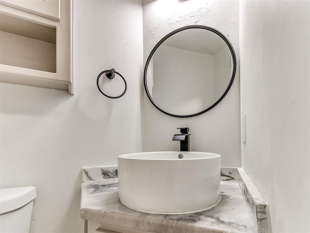 bathroom with toilet and sink