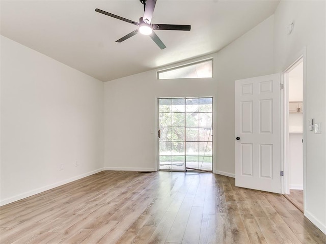 spare room with ceiling fan, high vaulted ceiling, and light hardwood / wood-style floors