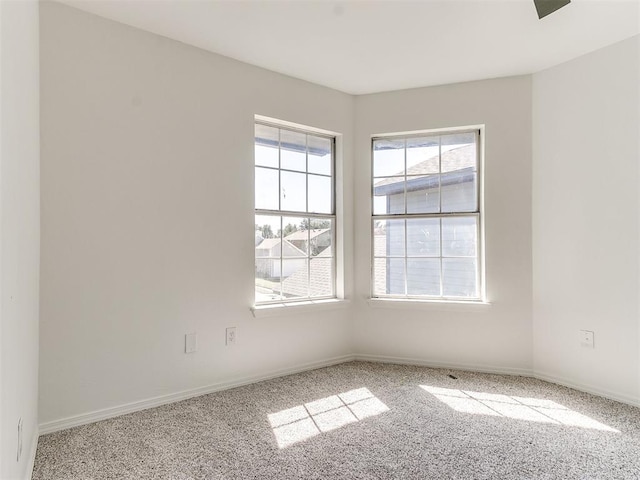 unfurnished room featuring carpet flooring