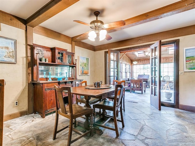 dining area featuring beam ceiling, french doors, and ceiling fan