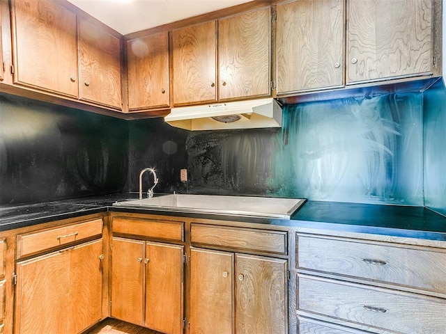 kitchen featuring tasteful backsplash and stovetop