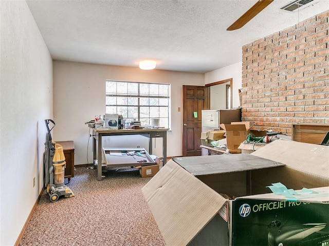 kitchen featuring a textured ceiling and carpet floors