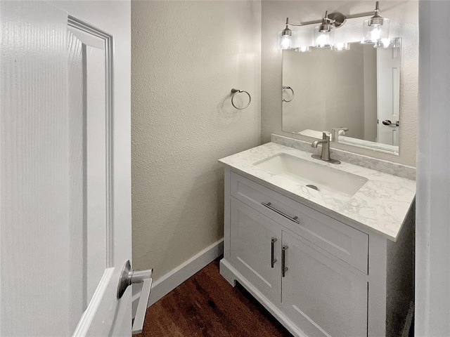 bathroom with wood-type flooring and vanity