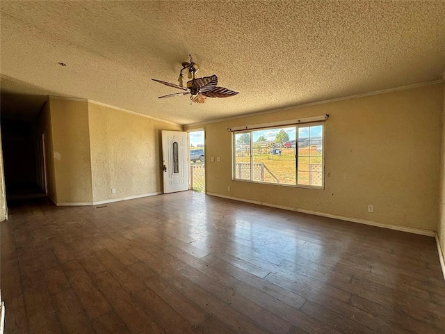 empty room with a textured ceiling, ceiling fan, crown molding, and dark hardwood / wood-style floors