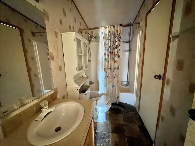 full bathroom with shower / bath combination with curtain, toilet, and vanity