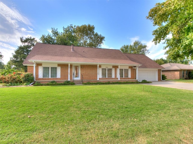 ranch-style house with a front yard and a garage