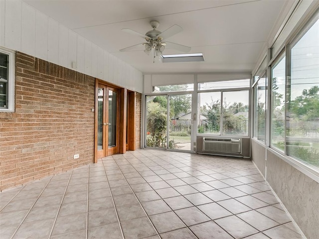 unfurnished sunroom featuring ceiling fan, cooling unit, and vaulted ceiling