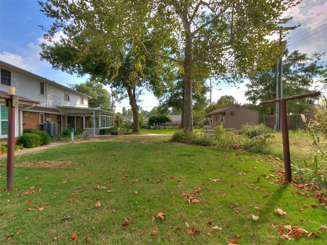 view of yard with a sunroom