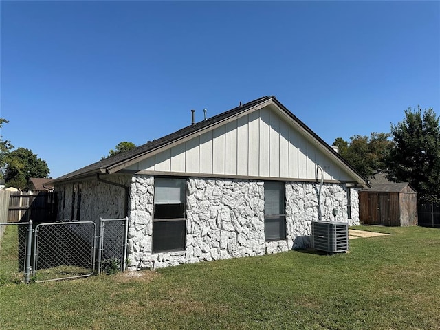 view of property exterior with a yard and cooling unit