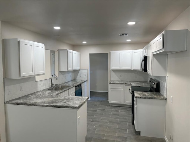 kitchen with sink, stainless steel appliances, dark hardwood / wood-style floors, decorative backsplash, and white cabinets