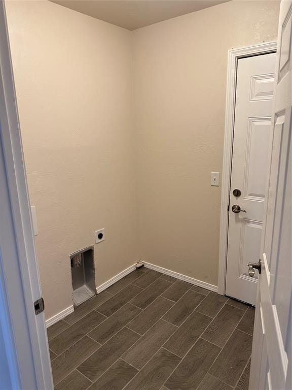 washroom with electric dryer hookup and dark hardwood / wood-style floors