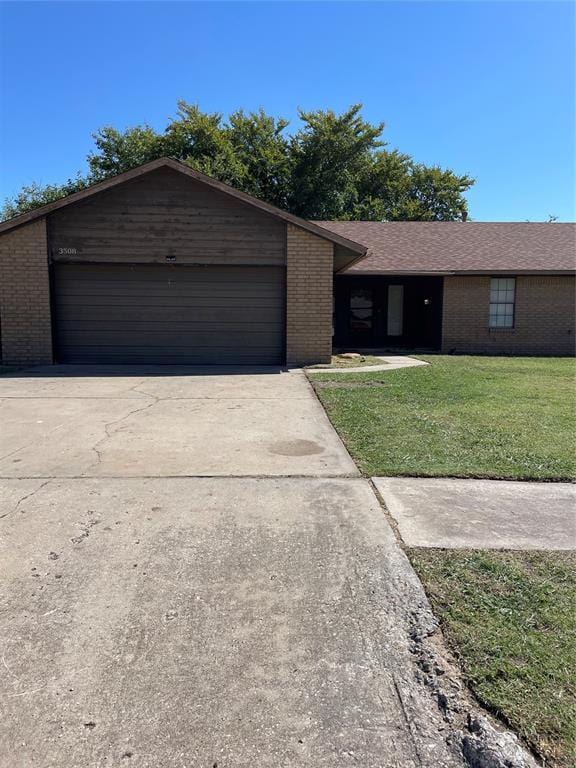 ranch-style home with a front lawn