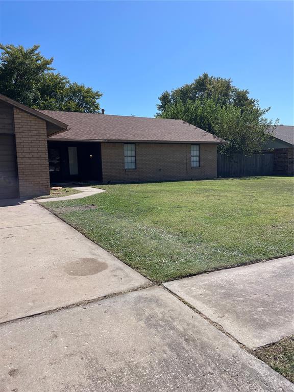 exterior space with a lawn and a garage