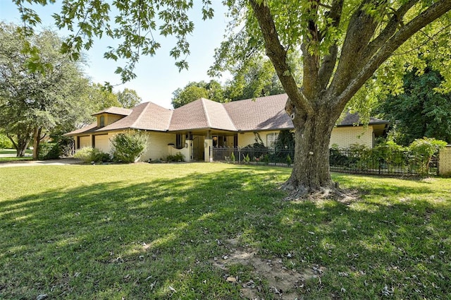 ranch-style house with a front yard