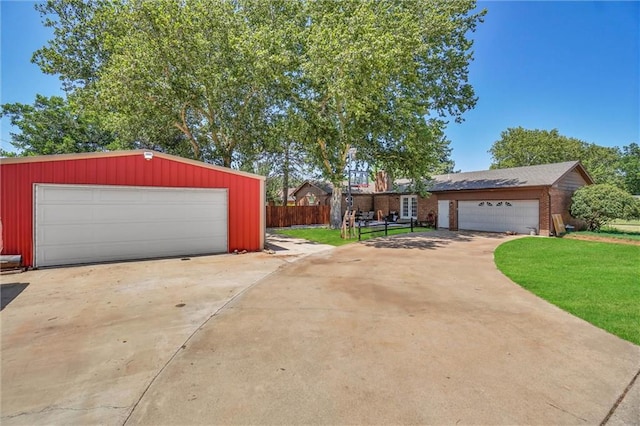 garage featuring a lawn