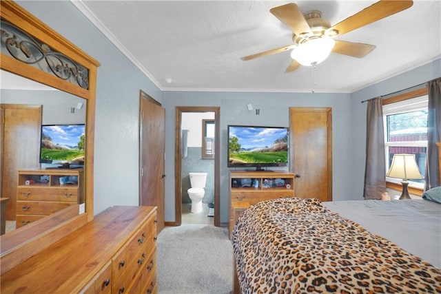 carpeted bedroom with ensuite bathroom, crown molding, and ceiling fan