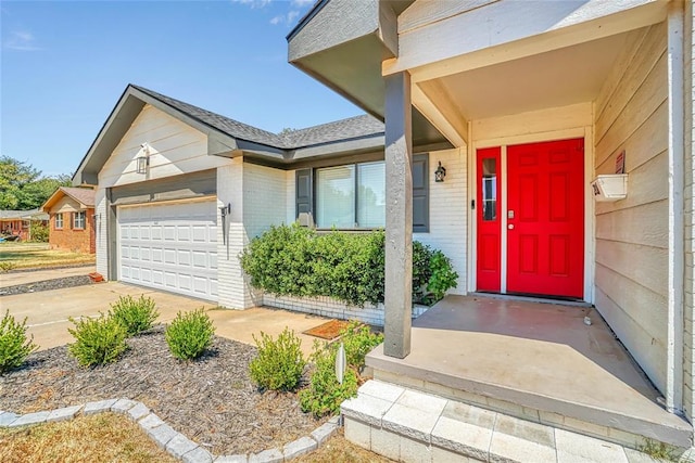 doorway to property featuring a garage