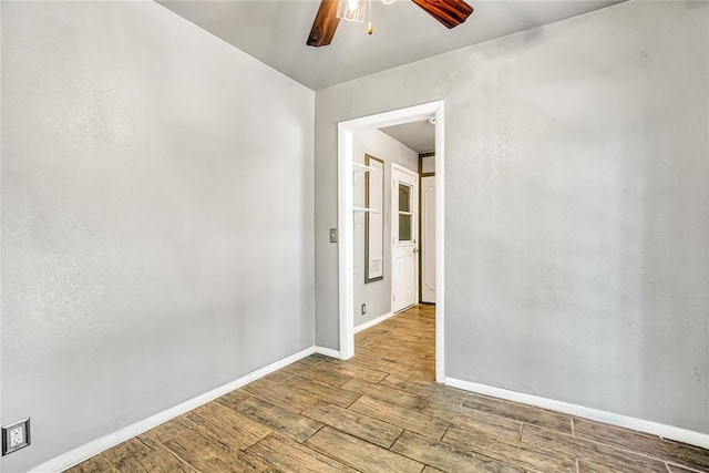 spare room featuring light wood-type flooring and ceiling fan