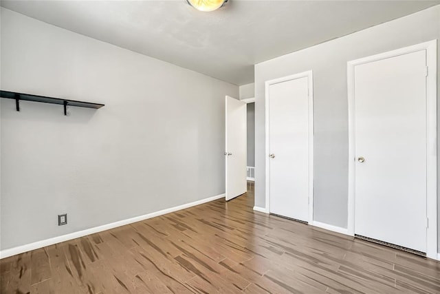 unfurnished bedroom featuring light wood-type flooring