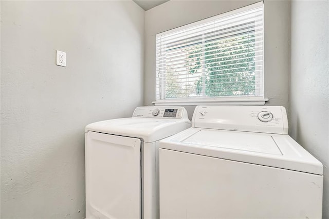 washroom featuring independent washer and dryer