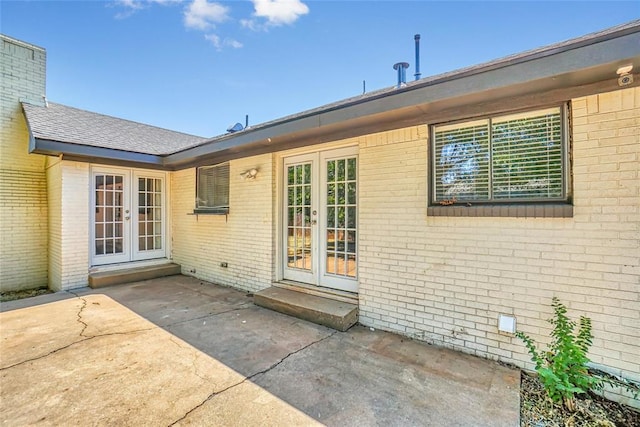 back of property featuring french doors and a patio