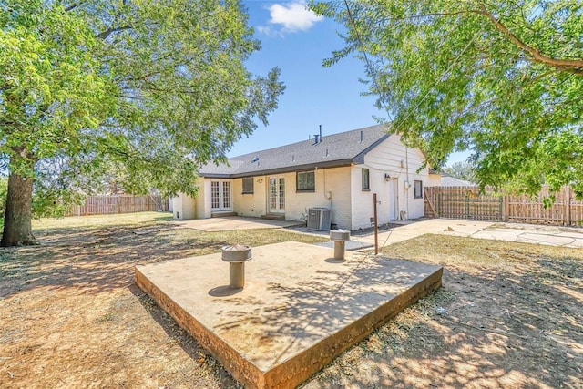 rear view of property featuring central AC, a patio area, and french doors