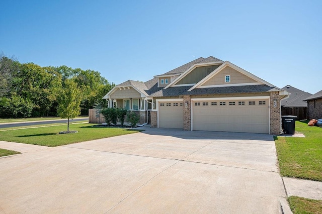 craftsman inspired home featuring a garage and a front yard