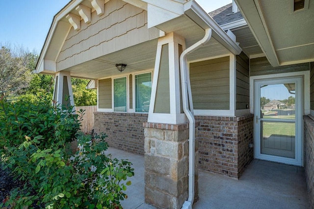 doorway to property featuring covered porch