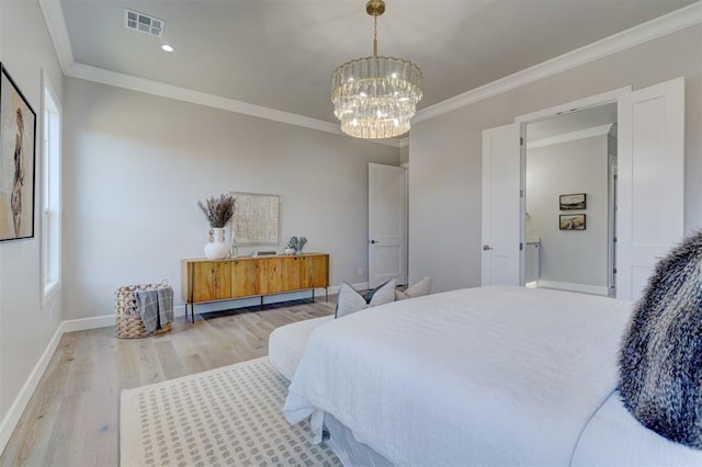 bedroom with an inviting chandelier, ornamental molding, and light wood-type flooring