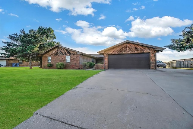 view of front of home with a front lawn and a garage