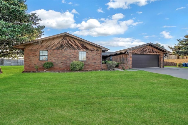 ranch-style house featuring a garage and a front lawn