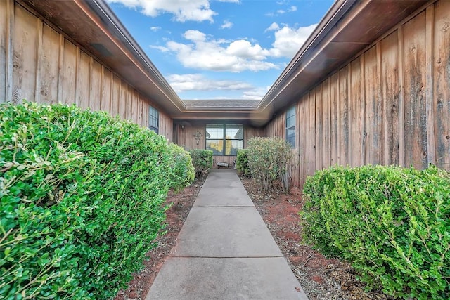 128 W Quail Dr, Cordell, OK 73632 - doorway to property featuring board and batten siding