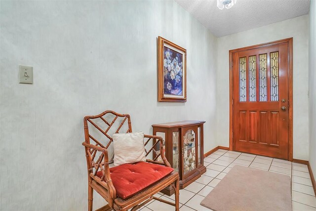 128 W Quail Dr, Cordell, OK 73632 - entrance foyer featuring light tile patterned floors, baseboards, and a textured ceiling