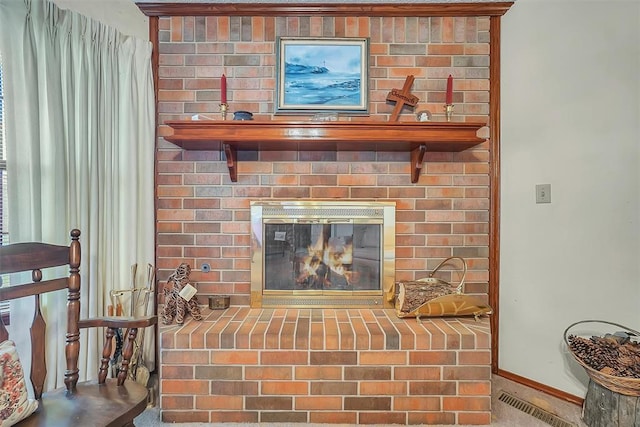 room details featuring a brick fireplace