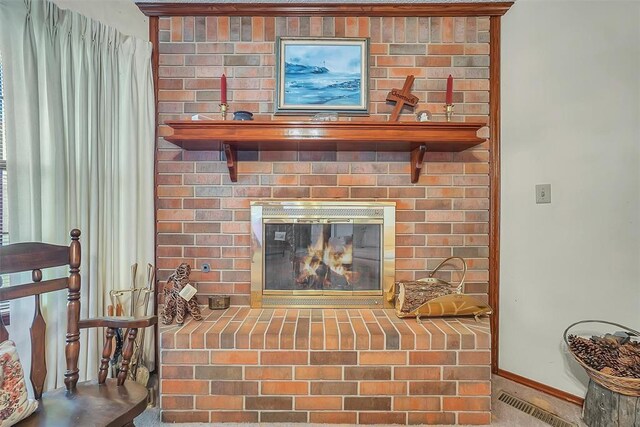 128 W Quail Dr, Cordell, OK 73632 - detailed view of baseboards and a fireplace