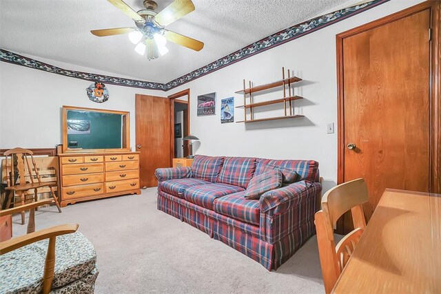 128 W Quail Dr, Cordell, OK 73632 - living area with carpet, a textured ceiling, and a ceiling fan
