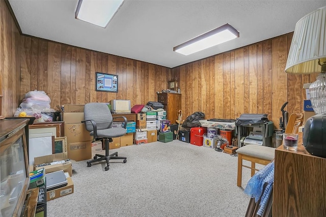 home office featuring carpet and wood walls