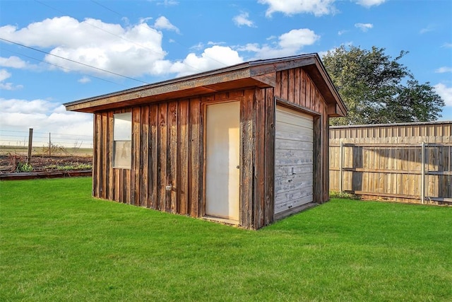 view of outbuilding with a lawn