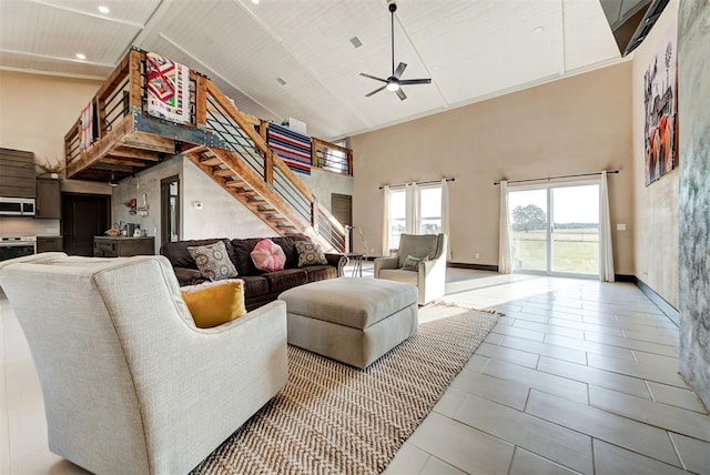 tiled living room with high vaulted ceiling, ceiling fan, and wood ceiling