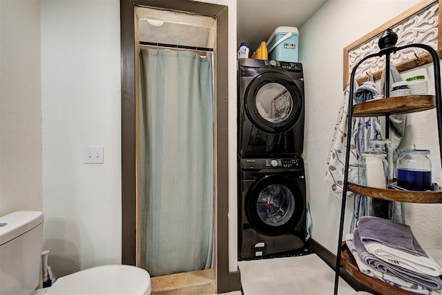 laundry room with stacked washer / dryer